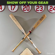 wo baseball memorabilia bats displayed on the wall in the HIDEit Crossed Bat Mount for show-stopping baseball decor.