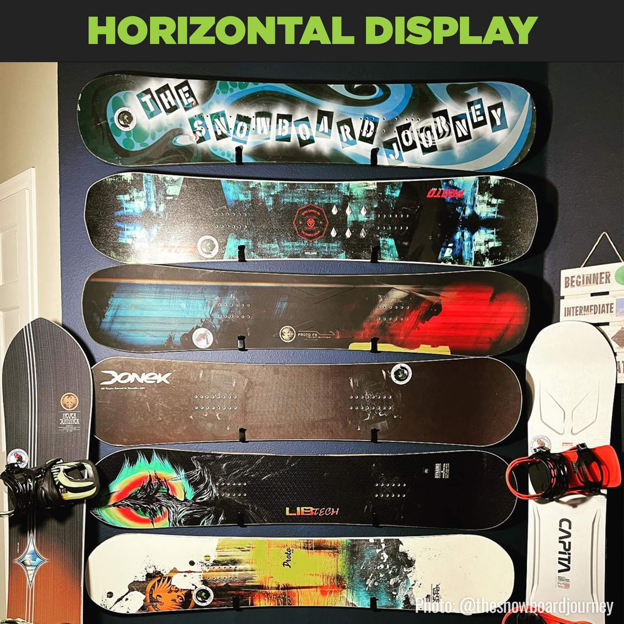 Horizontal display of six snowboards without bindings wall mounted using HIDEit Board Mount Clips.