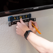 Gif of Roku Streambar Soundbar being mounted to the wall with the HIDEit Streambar Mount.