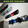 Four snowboards wall mounted up a staircase using HIDEit Horizontal Snowboard Mount Clips.