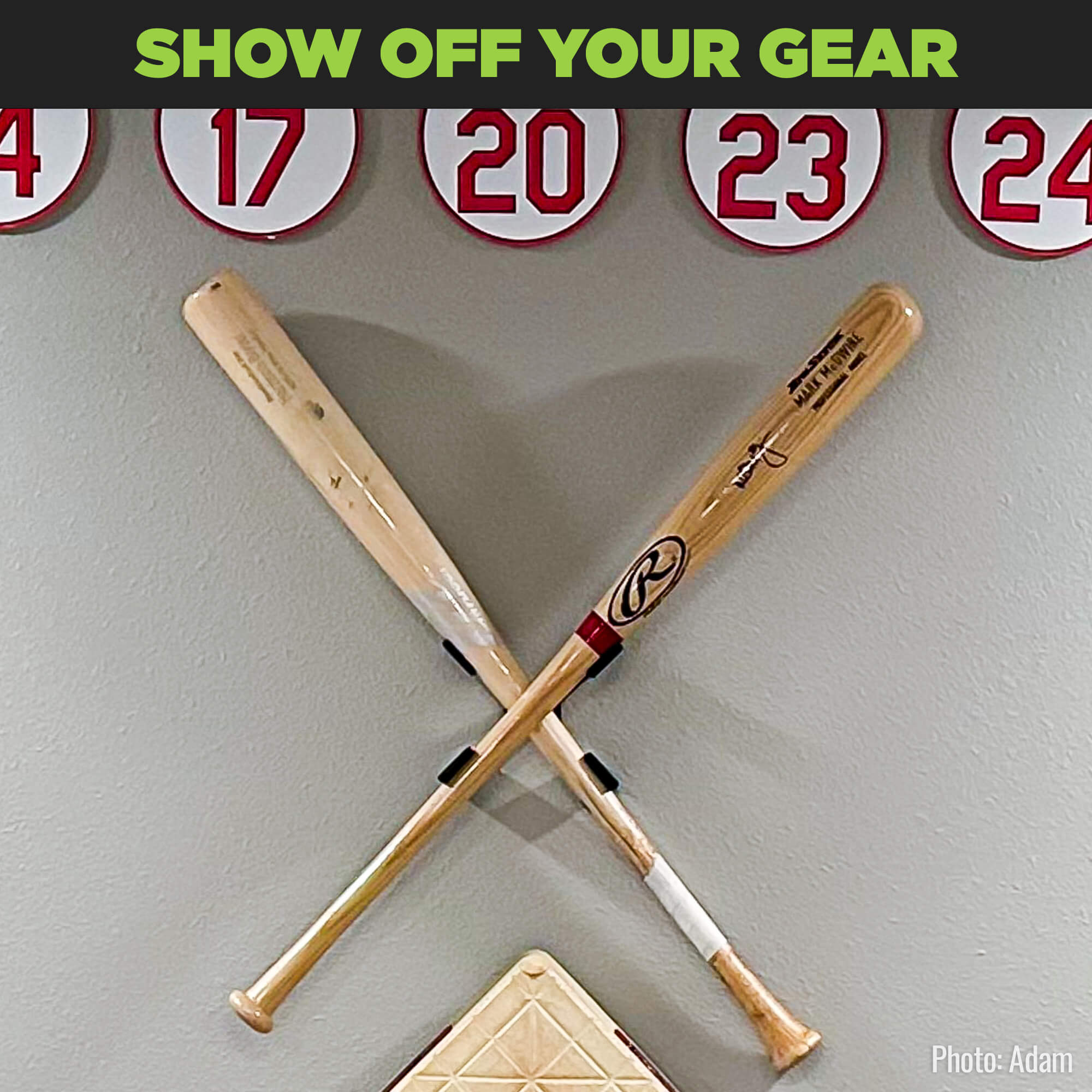 Two baseball memorabilia bats displayed on the wall in the HIDEit Crossed Bat Mount for show-stopping baseball decor.