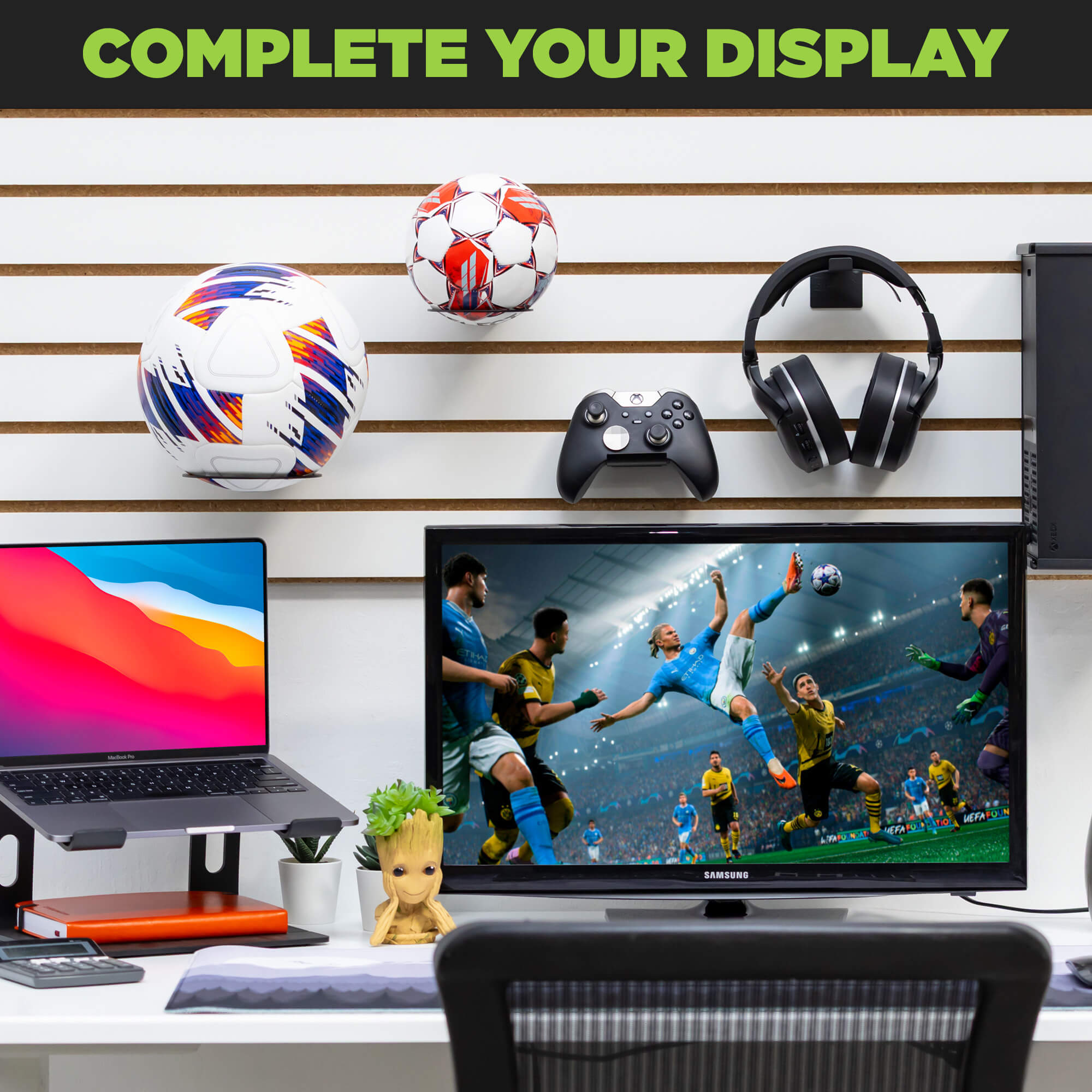 HIDEit Ball-XL Mount displaying soccer balls on wall above gaming setup and monitor.