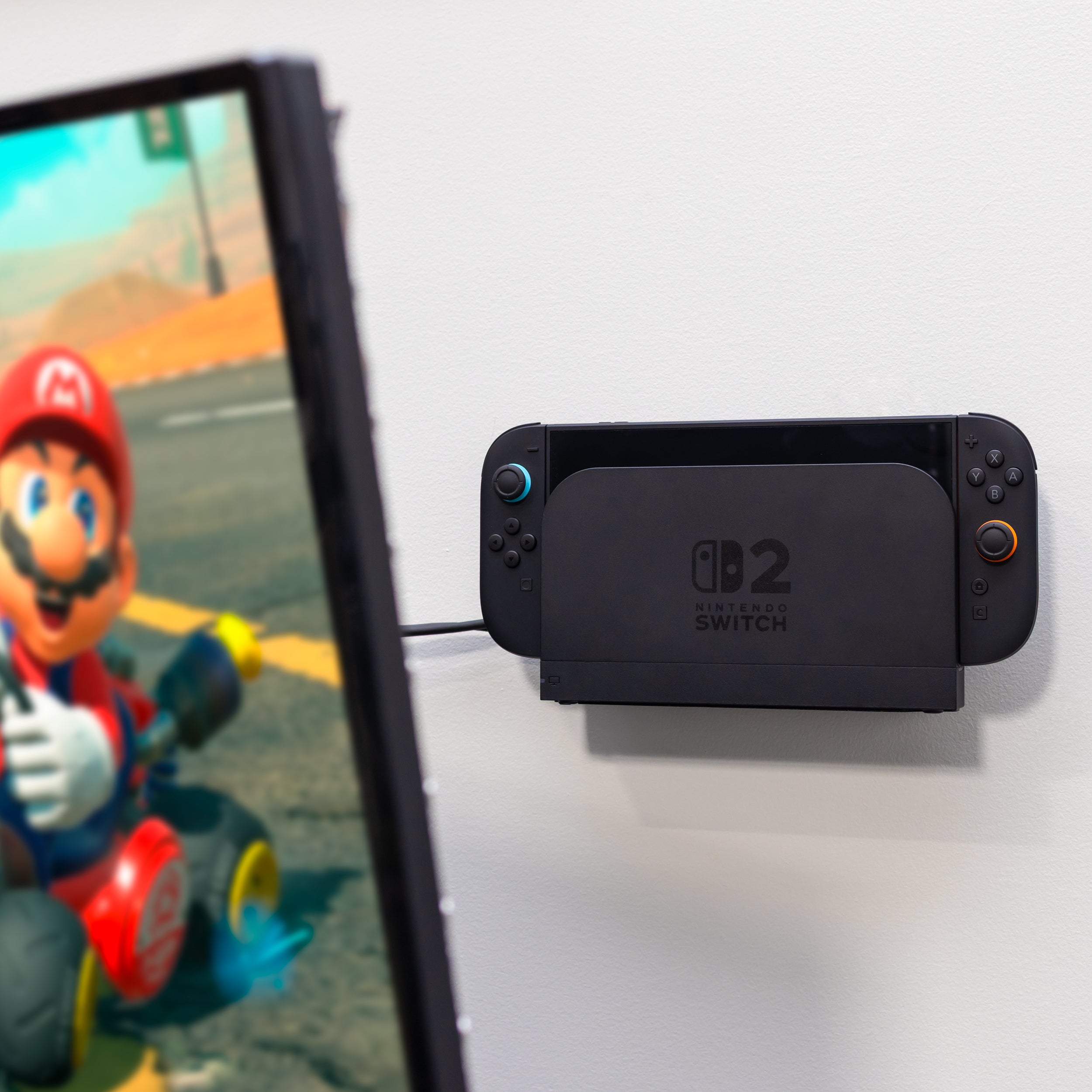 Nintendo Switch 2 is wall mounted behind a TV using HIDEit Mounts Nintendo Switch 2 Mount for a clean gaming setup.