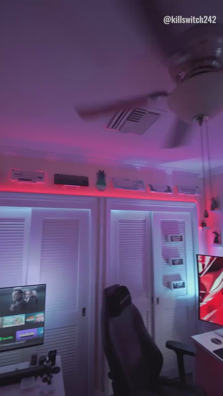 Keyboard wall mount installation in a clean white gaming desk setup for ergonomic storage and clutter-free workspace ideas.
