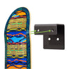 Colorful skateboard deck shown being mounted to the HIDEit Skateboard Deck Wall Mount.