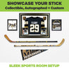 2 hockey sticks horizontally mounted on the wall with Las Vegas Golden Knights memorabilia. Perfect for any sports room. 