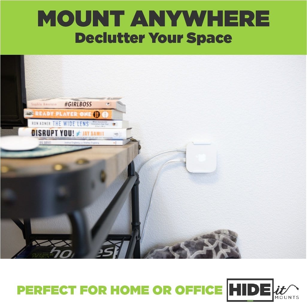 Wall mounted Apple AirPort Express Router next to a desk in a white, steel HIDEit Air-XS wall mount.