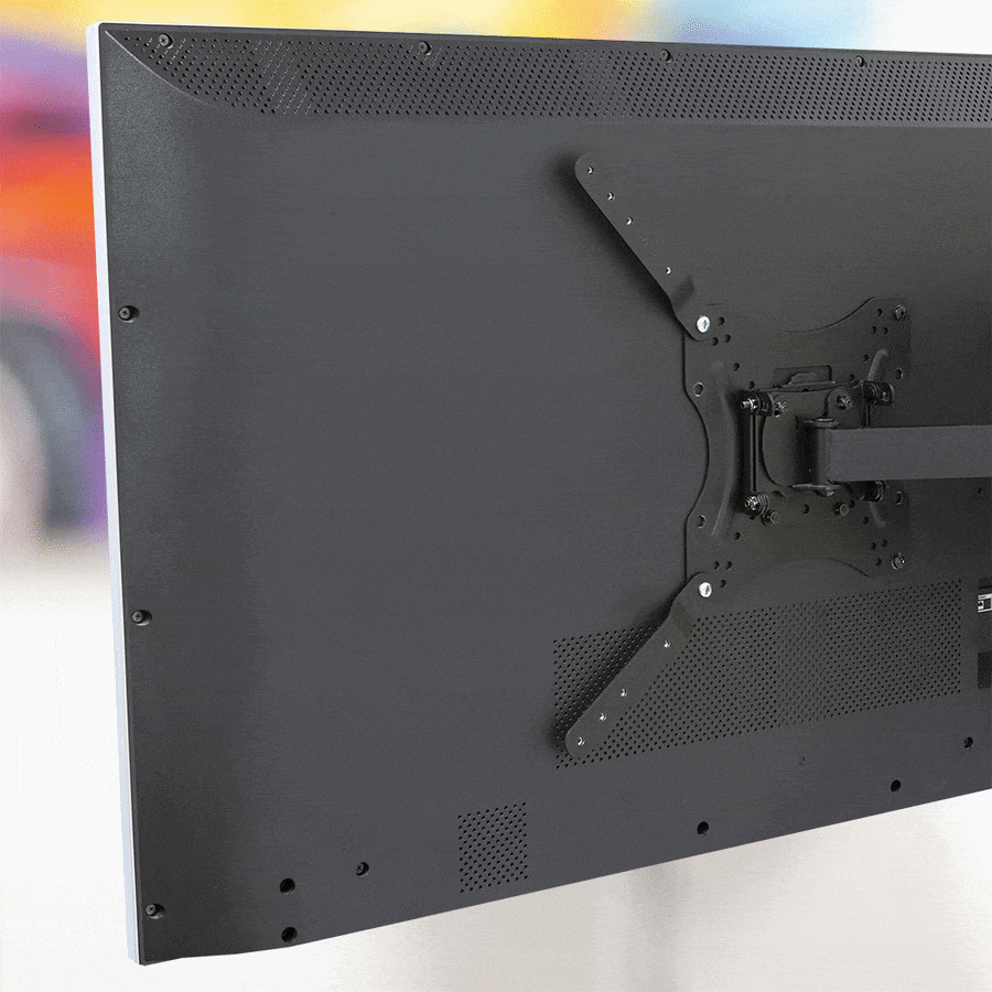 Gif of two HIDEit Uni-VESA Adapter Bars mounted to the back of a wall-mounted TV.