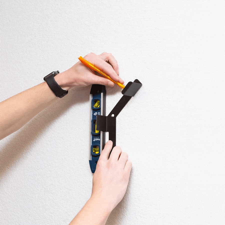 Gif of HIDEit Vertical Hockey Stick Mount being mounted to the wall. 